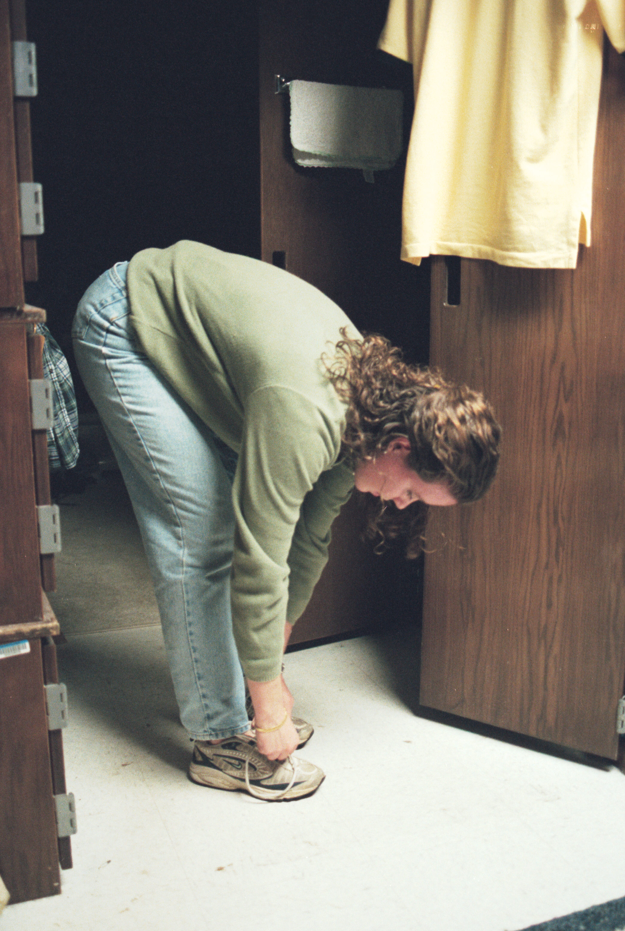 Melissa ties her shoe