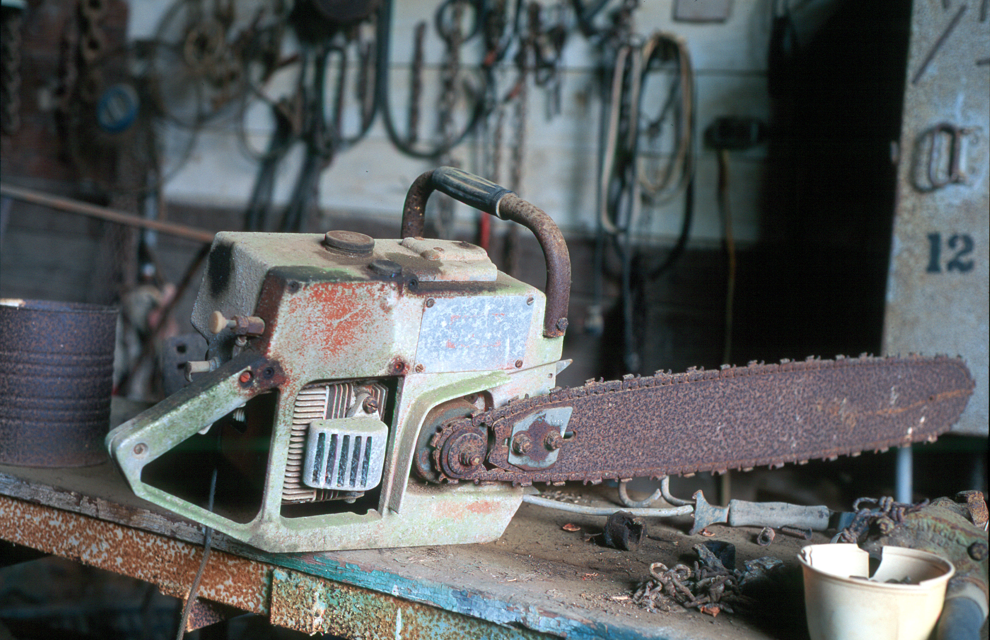 old chainsaw in barn