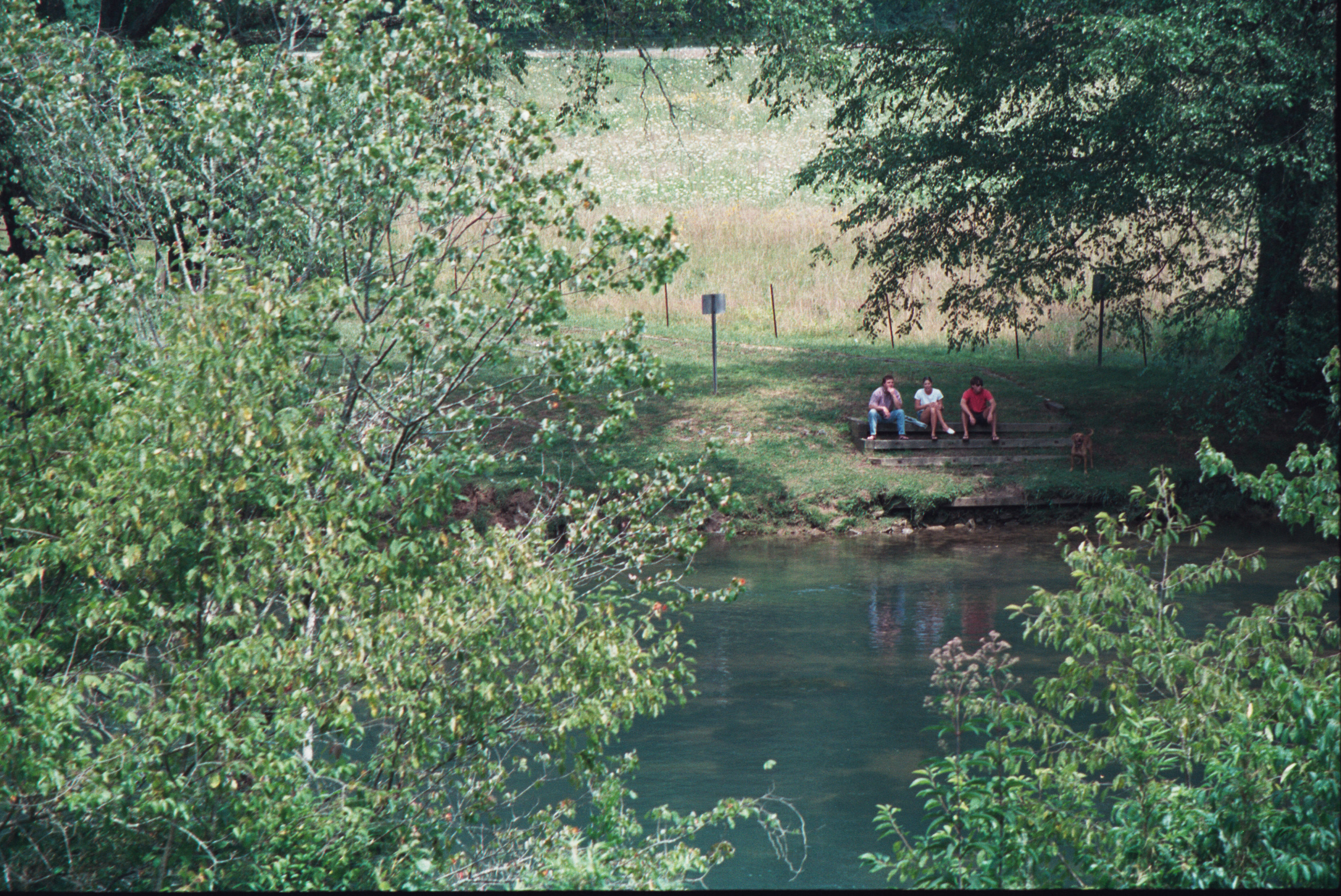 family by river