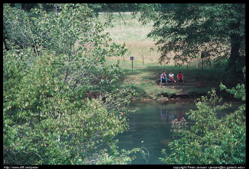 family by river