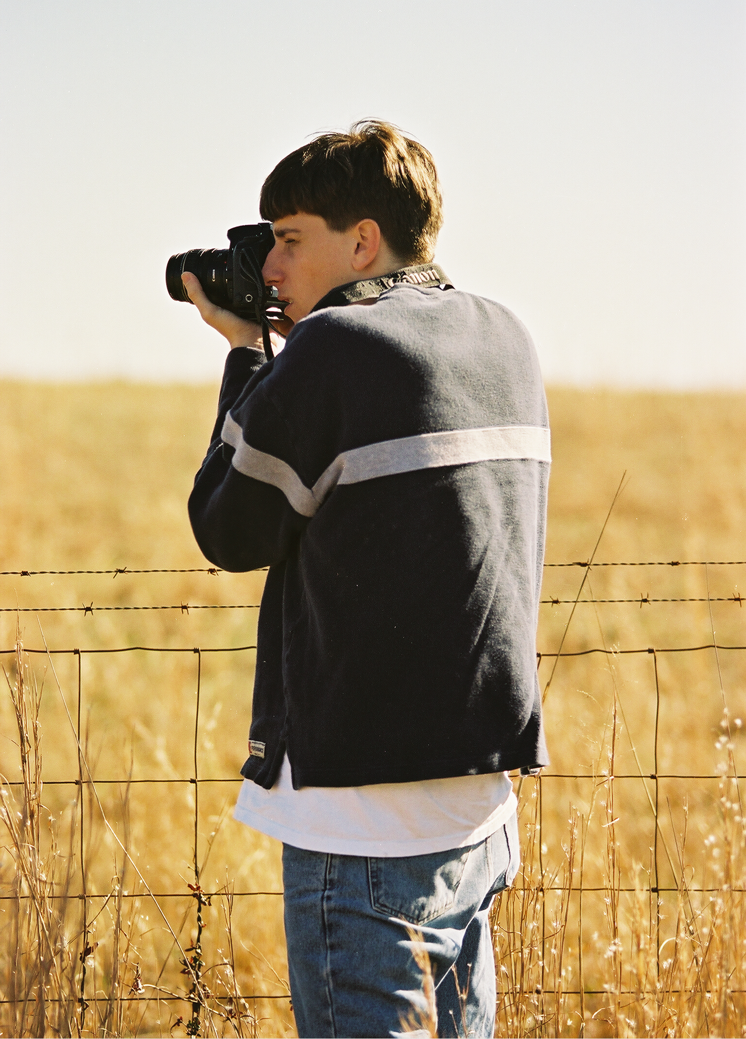 Myke shooting at the fence