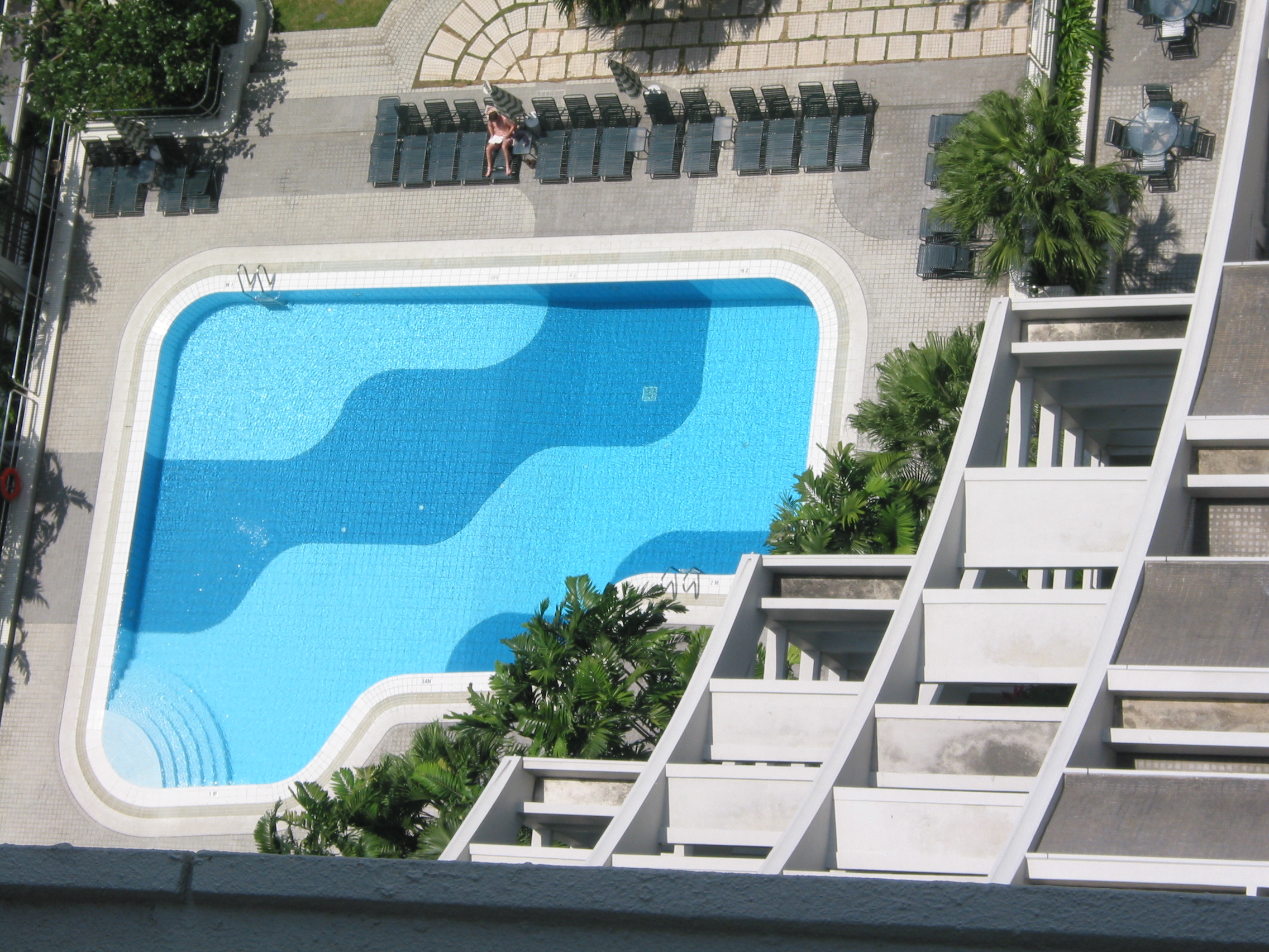 pool with lone sunbather