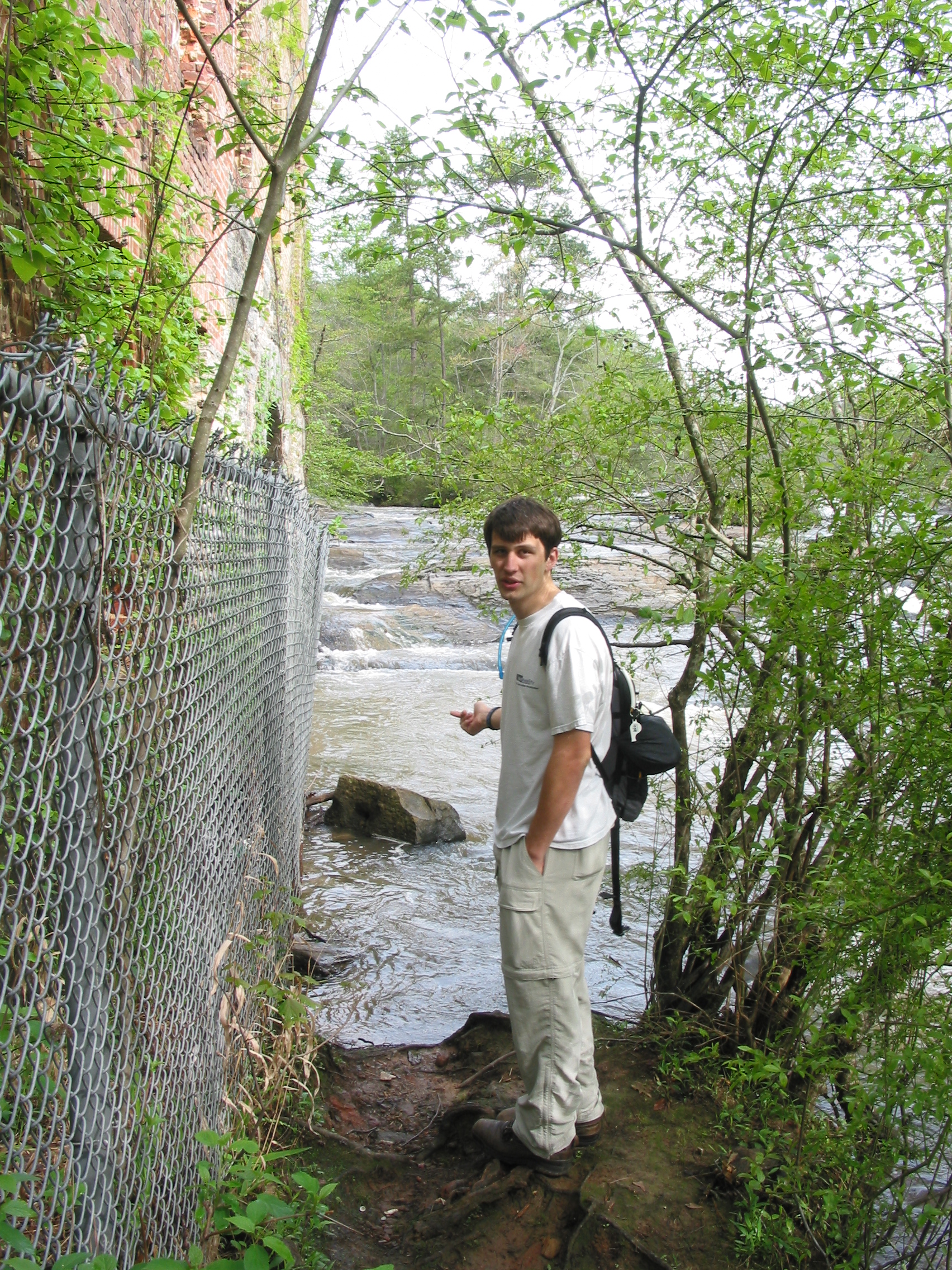 Charles on the creek side of the mill