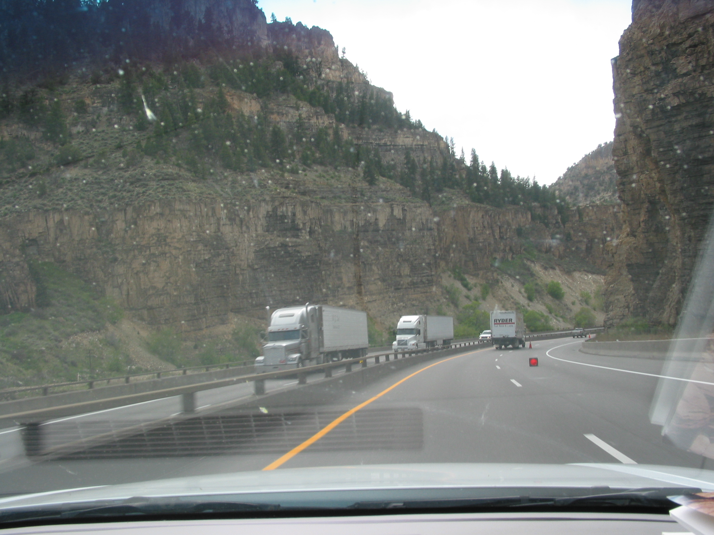 light rain; trucks knocking down cones