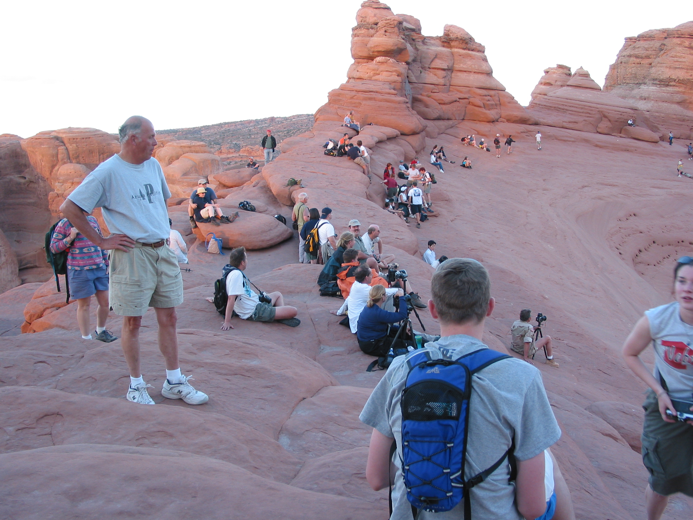 photographers and viewers preparing for sunset