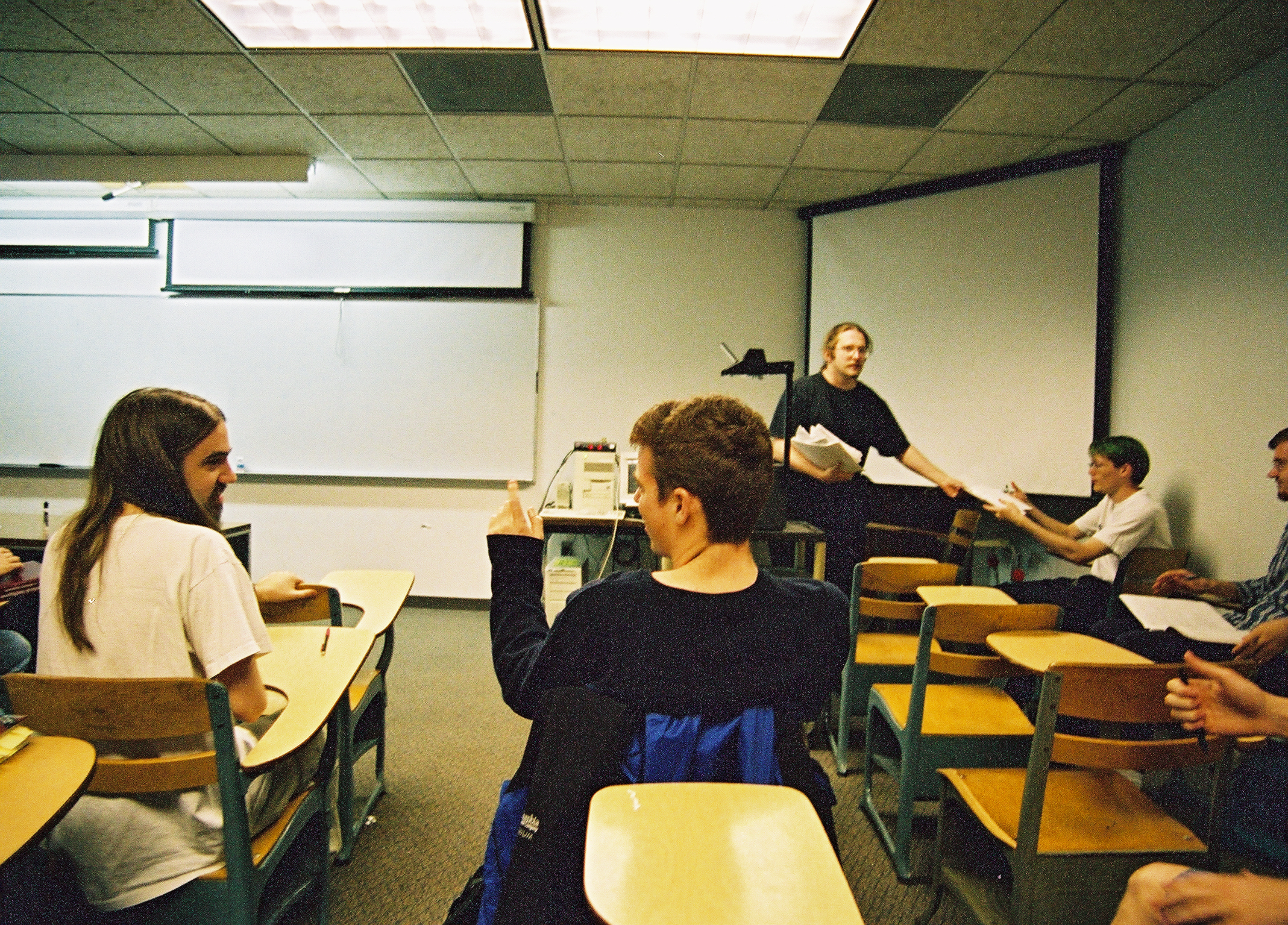 Thad handing out assignments in CS4600