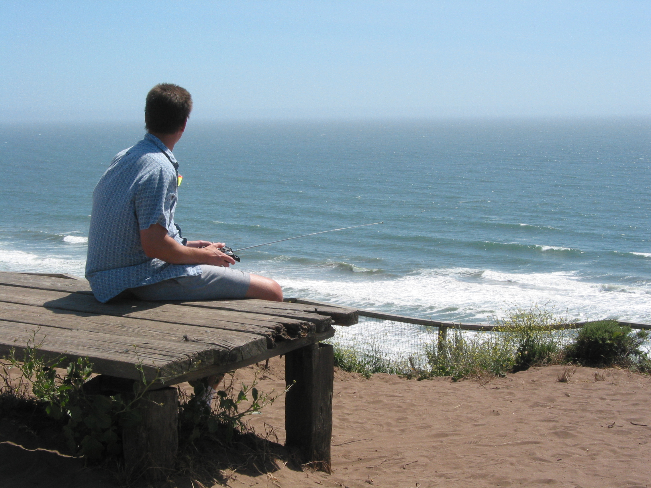 some guy sloping a fast own-design wing at Sunset Beach