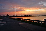 the sunset, as viewed from the Howell Mill Atlanta waterworks. High perspective images were shot over the fence with me standing on top of my bike rack; others were shot through the fence (hence the vingetting).