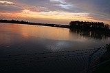 the sunset, as viewed from the Howell Mill Atlanta waterworks. High perspective images were shot over the fence with me standing on top of my bike rack; others were shot through the fence (hence the vingetting).