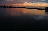 the sunset, as viewed from the Howell Mill Atlanta waterworks. High perspective images were shot over the fence with me standing on top of my bike rack; others were shot through the fence (hence the vingetting).