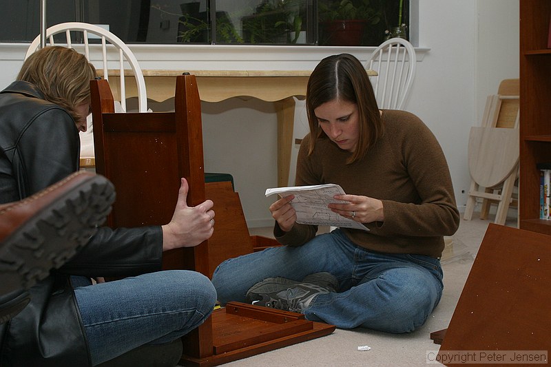 Callie and Kayla assembling the bed-side tables