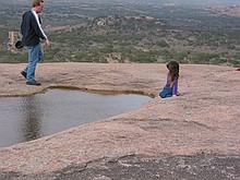 she almost fell in (which would have made a great picture!), but her father minded her to move away from the edge