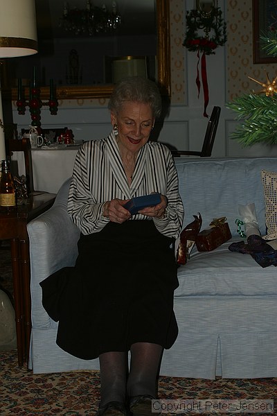 Grandmother opening a present