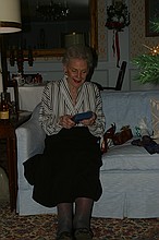 Grandmother opening a present