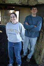 Meg and Charles in a pile of coal