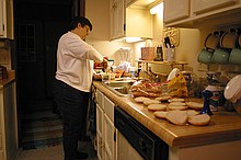 Charles' mother preparing a wonderful dinner