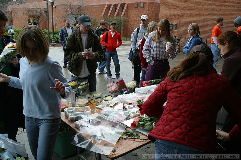 random people buying roses on Valentine's day