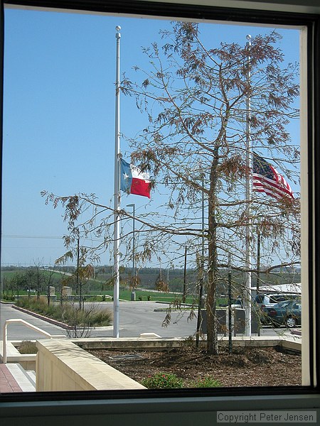 flags at half staff at the Pflugerville Justice Center