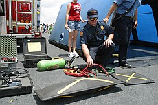 a fireman kindly demonstrated one of their heavy lifting bags to me -- an airbag similar to this one can be shoved under a fallen piece of comcrete (or structure) and can lift huge amounts.  This particular bag is rated for a maximum of 34.7 tons, which i