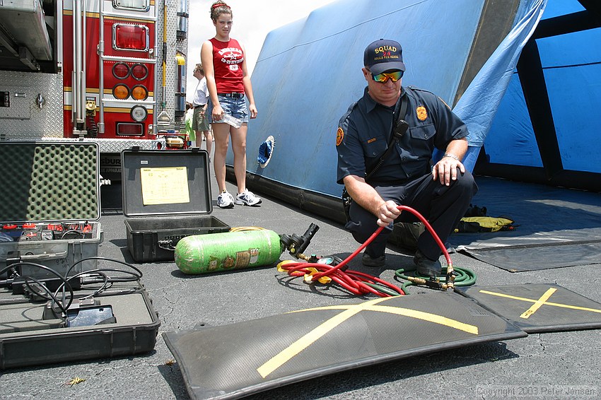 a fireman kindly demonstrated one of their heavy lifting bags to me -- an airbag similar to this one can be shoved under a fallen piece of comcrete (or structure) and can lift huge amounts.  This particular bag is rated for a maximum of 34.7 tons, which i