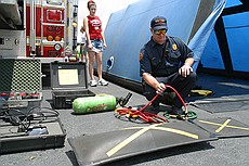 a fireman kindly demonstrated one of their heavy lifting bags to me -- an airbag similar to this one can be shoved under a fallen piece of comcrete (or structure) and can lift huge amounts.  This particular bag is rated for a maximum of 34.7 tons, which i