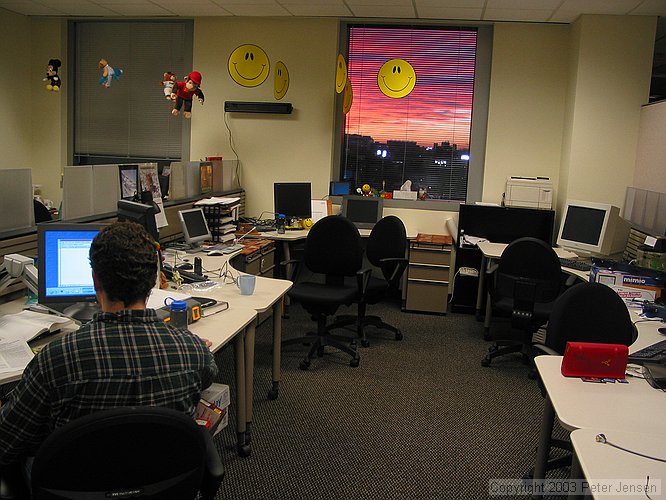 Jay working; sunset viewed out the windows in TSRB 3rd floor