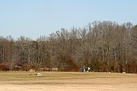 a family enjoying a day at the park with some rocketry