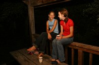 S and A hanging out with coffee on the porch