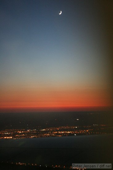 moon and wing over Toronto during departure