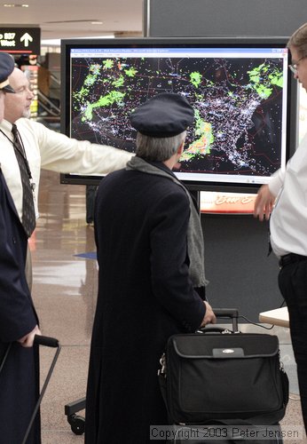 nice FAA guys doing PR in the Denver airport showing weather superimposed on IFR traffic