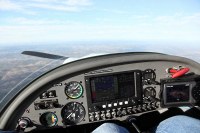 N17UA panel -  roughtly L-R, ignition (off with prop feathered), audio panel, varios, airspeed, altimeter, glass panel, throttle, radio, transponder, emergency parachute, Garmin 496