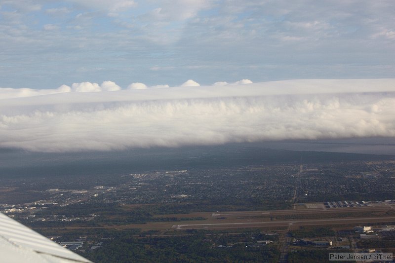 looking north over MLB as the front rolls in