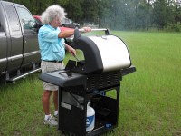 Alan graciously making burgers and dogs