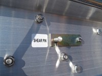 shear pin on a railroad crossing sign