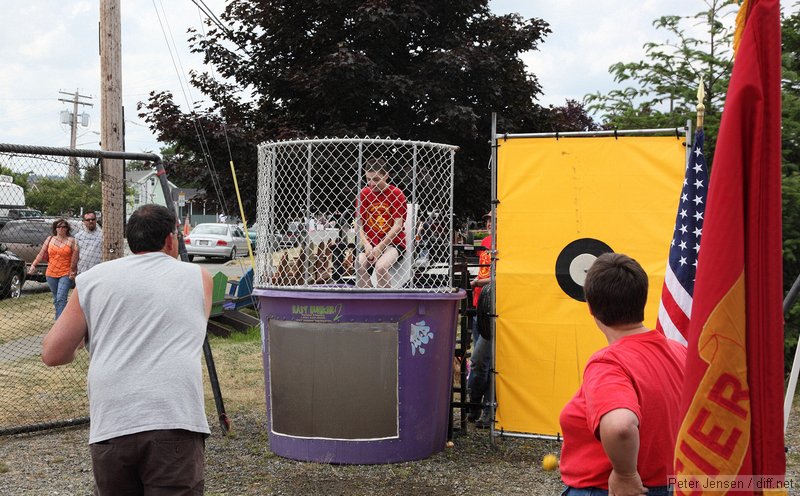 mid-slide at the dunking booth at the Buckley Log Show