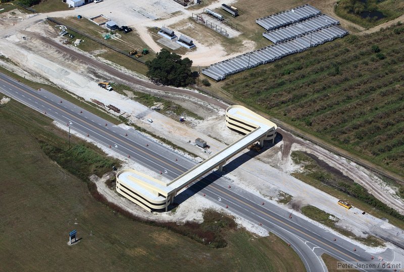 massive bridge over a road by a high school out in the country