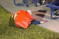 optimal nap-taking situation - feet dry, body comforted by the soft grass, and protected from dew by the space blanket