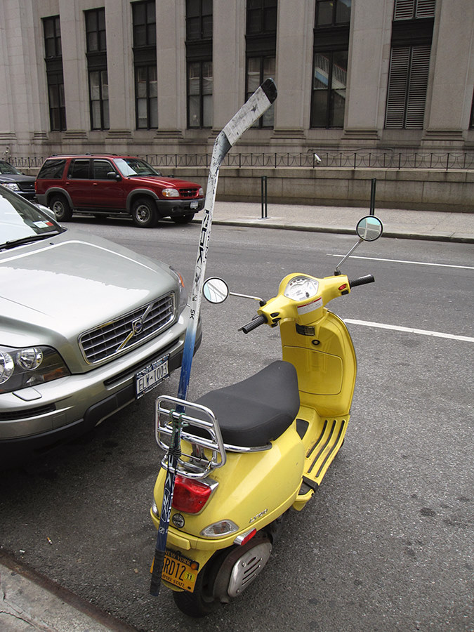 hocky stick on a scooter - of course!