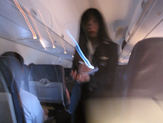 cool southwest flight attendant with a dollar-store LED lit pen