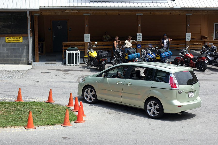 driver is wearing a full-face helmet and gloves