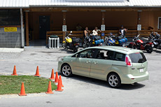 driver is wearing a full-face helmet and gloves