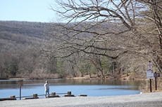 a fisherman enjoying an early morning on Laurel Forge Pond