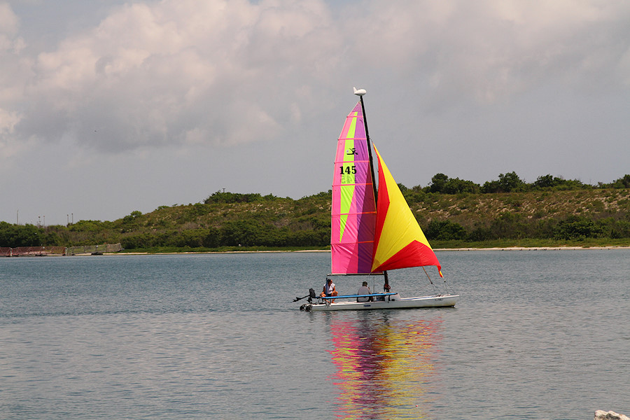 from Jetty Park, a Hobie Cat heading out in light wind