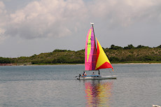 from Jetty Park, a Hobie Cat heading out in light wind