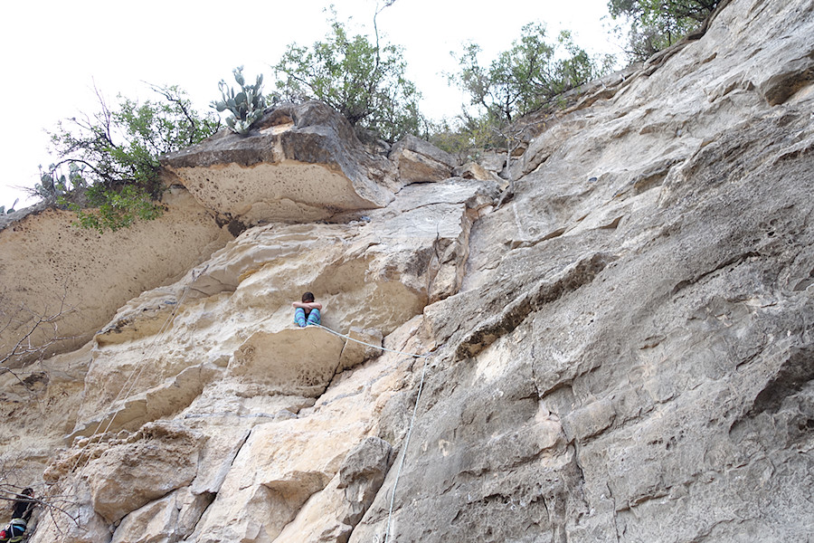 the sit of shame - she was one draw short on Over Easy (5.9). Another climber hooked her up moments later and she finished the route.