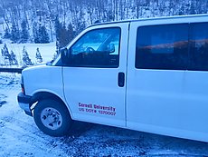 Cornell University parked two 15-passenger vans very inefficiently in the small lot