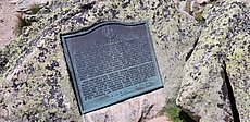 This tablet is placed here by the Forest Commissioner of Maine under order of the governor and Executive Council dated March 16, 1932 to record the gift and conveyance to the state on March 3, 1931 and October 7, 1931 by Percival Proctor Baxter, governor 1921-1925, of nine square miles of land in township 3 range 9 Mt. Katahdin, within which area are located this the highest peak of the mountain 5267 ft., named Baxter Peak by the state legislature laws of Maine 1931, South Peak 5240 ft., Pamola Peak 4902 ft., the North Peaks 4734 ft. and 4612 ft., the Knife Edge, the Chimney, the Tableland, Chimney Pond 2914 ft., Dry Pond 2799 ft., North West Plateau 4401 ft., Harvey Ridge 4182 ft., Hamlin Peak 4751 ft., Rum Mountain 3361 ft. and the Great, North and South Basins.