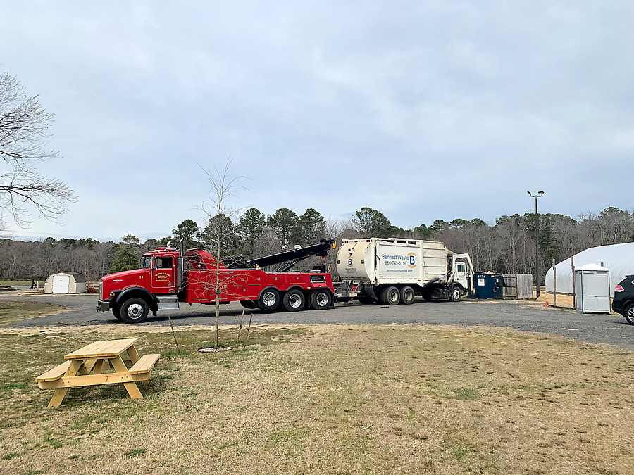 radiator failure on the trash truck, so we got to watch them tow it away