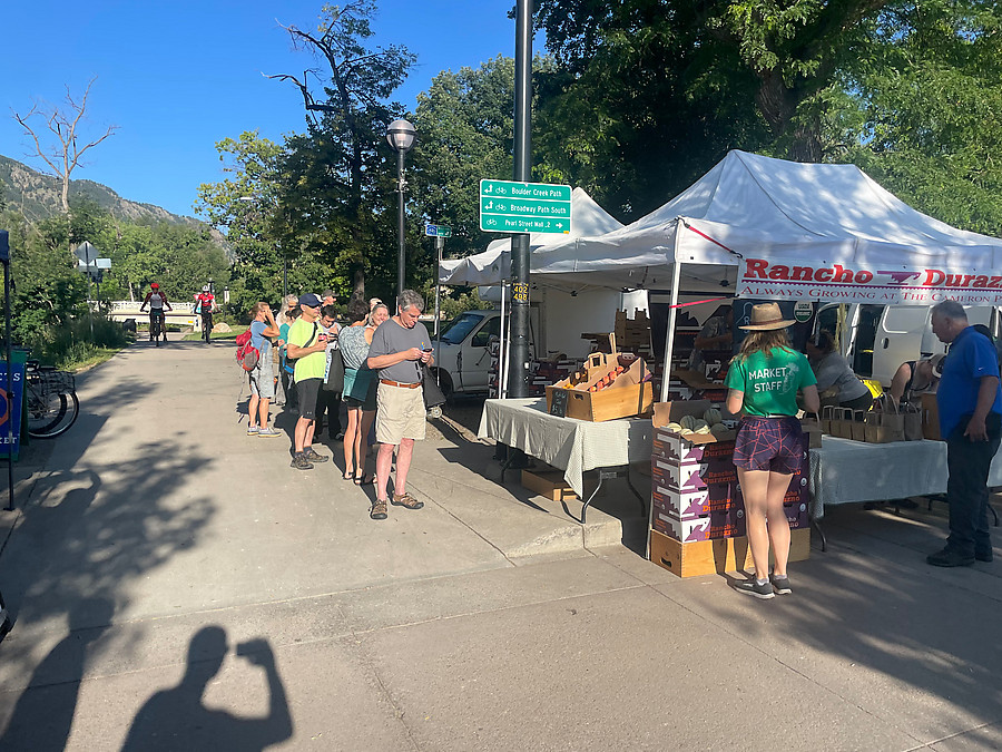 giant lines forming before opening time at the farmer's market